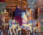Catherine on a carousel near the Eiffel Tower
