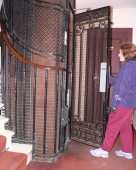 Catherine using the old fashioned lift at our Hotel
